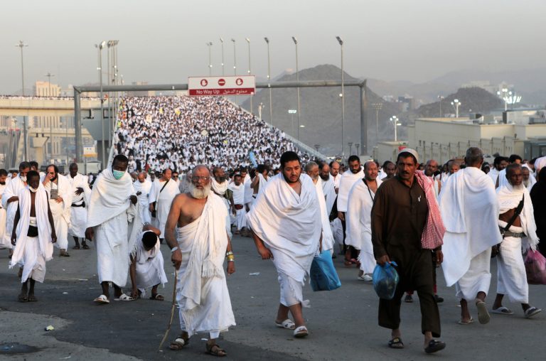 Thousands of Muslim pilgrims make their way to throw stones at a pillar, symbolizing the stoning of Satan in a ritual called 