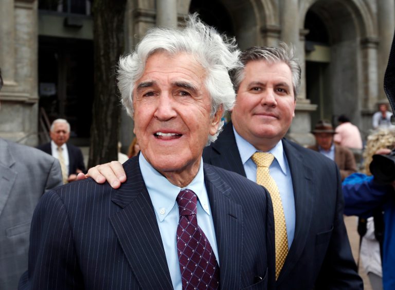 Former New York state Sen. Joseph Bruno, left, and his son Ken Bruno walk away from the federal courthouse after a jury found him not guilty of federal fraud charges on Friday, May 16, 2014, in Albany, N.Y. Bruno was accused of accepting $360,000 in consulting fees in monthly installments in 2004-2005, plus $80,000 for his share in a worthless racehorse, from Abbruzzese in return for helping his businesses with state grants and advancing his interest in New York's thoroughbred racing. (AP Photo/Mike Groll)
