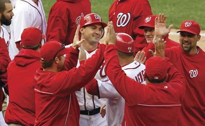 Rob Carr/Getty Images
Ryan Zimmerman scored the game-winning run in the Nationals'home opener.