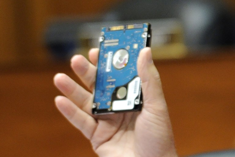 Rep. Mark Meadows, R-N.C., holds up a hard drive during the investigation of whether the IRS' targeted conservative organizations. Meadows asked how easy or difficult to scratch a hard drive. (AP Photo)