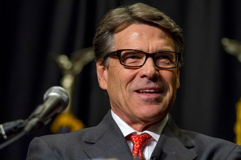 Texas Gov. Rick Perry speaks at the Polk County Republican Party fall fundraiser dinner at the Embassy Suites in Des Moines, Iowa, on Thursday, Nov. 7, 2013. Perry returned to Iowa for the first time since his presidential run last year. (AP Photo/Justin Hayworth)