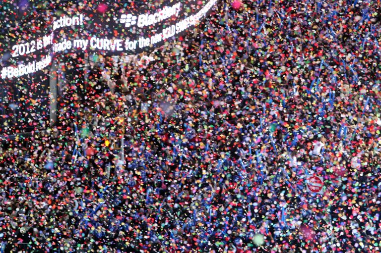   FILE - In this Dec. 31, 2011 file photo, confetti flies over New York's Times Square as the clock strikes midnight during the New Year's Eve celebration as seen from the balcony of the Marriott Marquis hotel. Itâs no small task making sure the annual celebration remains safe, but the New York City police use an array of security measures for the event that turns the 