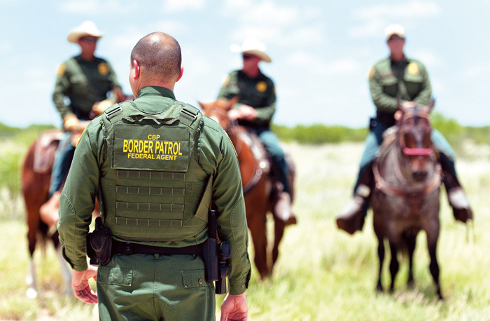U.S. Border Patrol agents work in a field near Carrizzo Springs, Texas. (Eddie Seal/Bloomberg)
