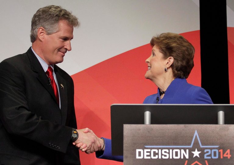 U.S. Sen. Jeanne Shaheen, right, greets GOP challenger Scott Brown before the live debate on Tuesday night. (AP/Concord Monitor/Elizabeth Frantz)