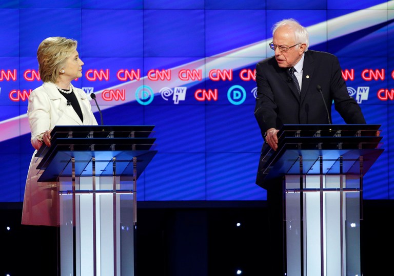 Democratic presidential candidates Sen. Bernie Sanders, I-Vt., right, and Hillary Clinton speak during the CNN Democratic Presidential Primary Debate at the Brooklyn Navy Yard on Thursday, April 14, 2016 in New York. (AP Photo/Seth Wenig)