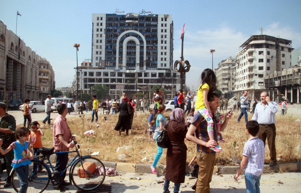 Syrians return to damaged homes after rebels leave