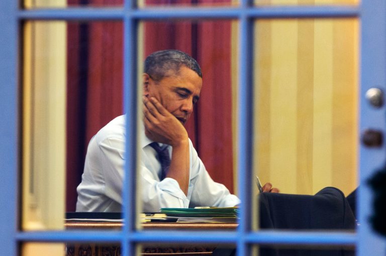 President Barack Obama works at his desk in the Oval Office of the White House in Washington on Jan. 27 ahead of Tuesday night's State of the Union speech. (AP Photo/Jacquelyn Martin)