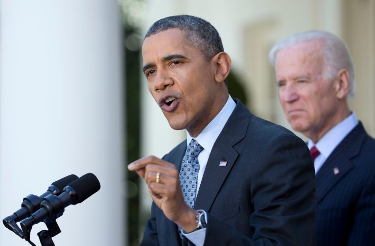 President Barack Obama , accompanied by Vice President Joe Biden speaks about the Affordable Care Act, Tuesday, April 1, 2014, in the Rose Garden of the White House in Washington.  (AP Photo/Manuel Balce Ceneta)