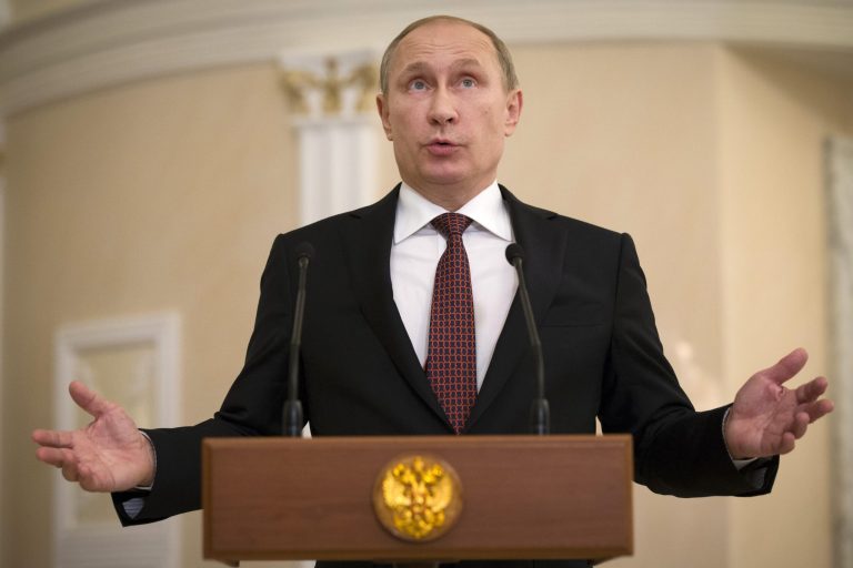 Russian President Vladimir Putin gestures as he speaks to the media after the peace talks in Minsk, Belarus, Thursday. (AP/Alexander Zemlianichenko)