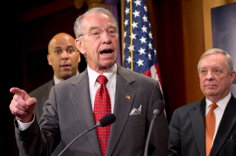 Senate Judiciary Committee Chairman Sen. ChuckÂ Grassley, center, flanked by Sen. Cory Booker, left, and Senate Minority Whip Richard Durbin, speaks about criminal justice reform. (AP Photo/Jacquelyn Martin)