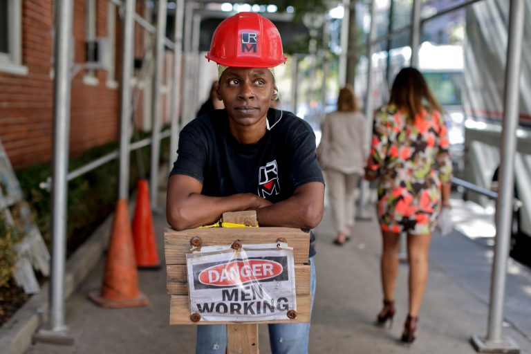 In this Aug. 14, 2014 photo, Sophia McIntosh stands for a photo outside a construction site where she works as a shop steward, in New York. The latest federal data shows about 7.1 million Americans were employed in construction-related occupations last year and only 2.6 percent were women. (AP Photo/Julie Jacobson)