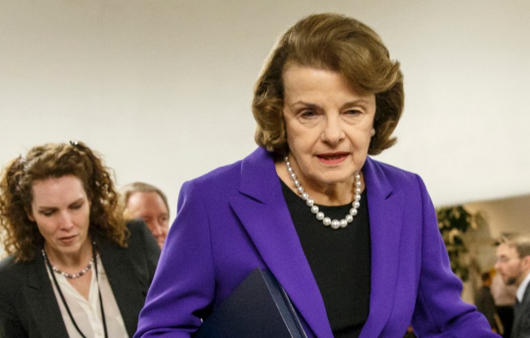 Senate Intelligence Committee Chair Sen. Dianne Feinstein, D-Calif. is pursued by reporters on Capitol Hill in Washington, Tuesday, Dec. 9, 2014. (AP Photo/J. Scott Applewhite)