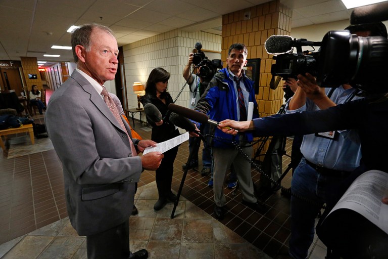 The Wilkins' family spokesman Michael Perini reads a family statement to members of the media following a preliminary hearing of the case Tuesday, May 5, 2015. (AP Photo/Brennan Linsley)