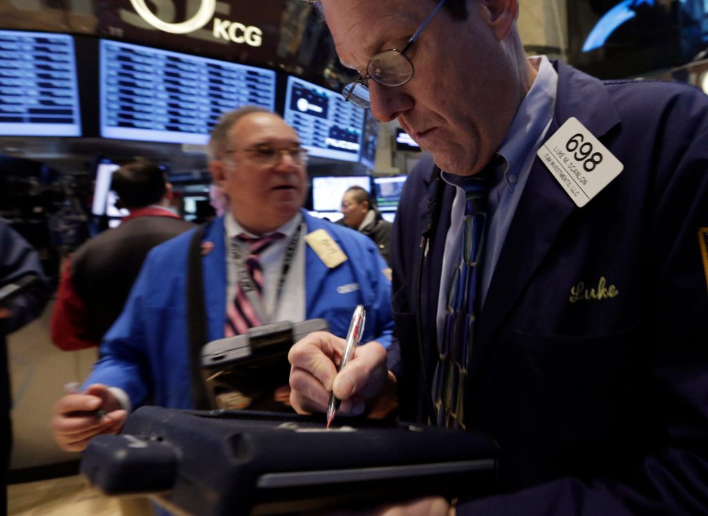 Stocks slide on weak earnings; Fed cuts stimulus
