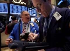 Stocks slide on weak earnings; Fed cuts stimulus