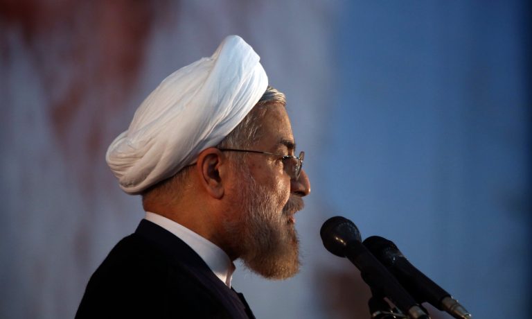 Iranian President Hassan Rouhani makes an address during a ceremony marking the 25th death anniversary of Ayatollah Khomeini, the founder of the Islamic Republic, at his shrine just outside Tehran, Iran, Tuesday, June 3, 2014. Iran's moderate president said Tuesday that his administration will defend the Islamic Republic's nuclear rights and work to end international sanctions that have devastated its economy. (AP Photo/Vahid Salemi)