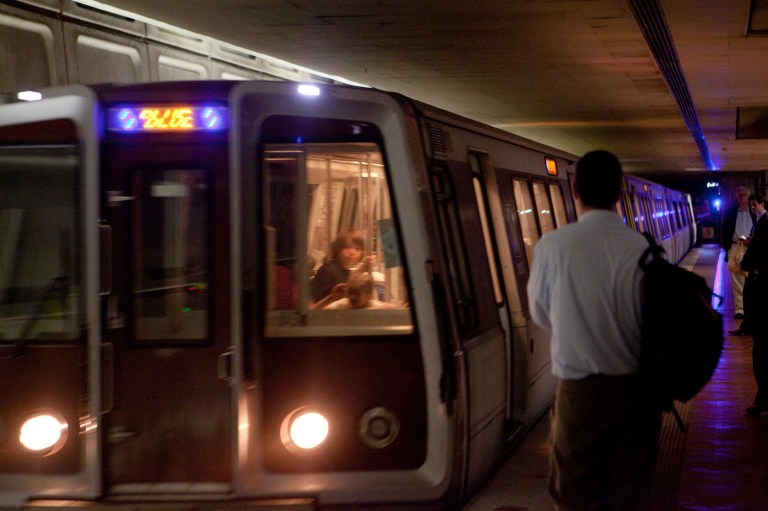 Metro operator stops train before it runs over woman on tracks