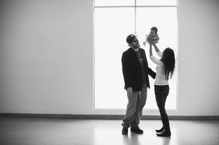 This February 2014 photo provided by I Heart New York shows Kristain and Anzalee Rhodes with their daughter Arabelle, at 5 months old, on their first family trip to the Brooklyn Museum in New York City. The couple are hiring photographers from I Heart New York to document their experiences watching their daughter grow. Hiring professional photographers to capture everyday life and not just important events like weddings has become a lifestyles trend. (AP Photo/I Heart New York)