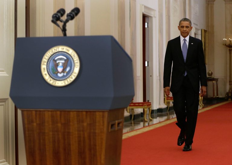   President Barack Obama walks to the podium before addressing the nation in a live televised speech from the East Room of the White House in Washington, Tuesday, Sept. 10, 2013. President Obama blended the threat of military action with the hope of a diplomatic solution as he works to strip Syria of its chemical weapons. (AP Photo/Evan Vucci, Pool)  