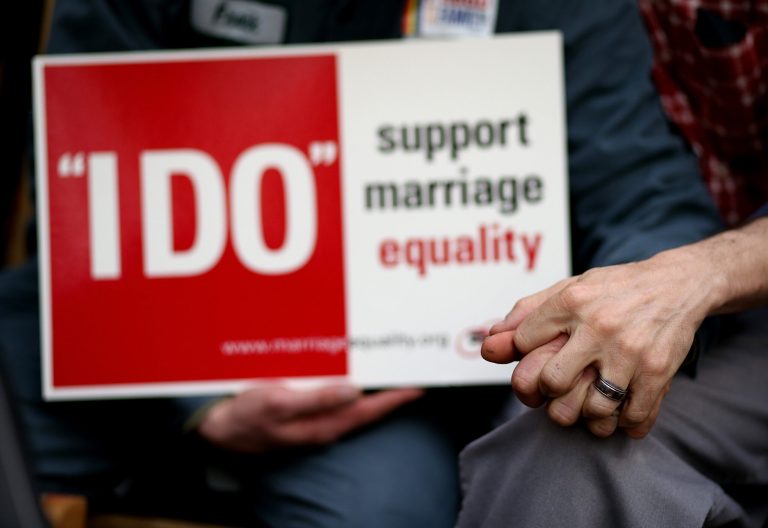 SAN FRANCISCO, CA - FEBRUARY 14:  Same-sex couple Frank Capley (L) and Joe Alfano (R) hold hands before staging a sit-in protest after same-sex couples were denied marriage licenses from the San Francisco county clerk on February 14, 2013 in San Francisco, California. Close to a dozen same-sex couples who were denied marriage licenses were arrested after they staged a sit-in demonstration inside the office of San Francisco's county clerk.  (Photo by Justin Sullivan/Getty Images)