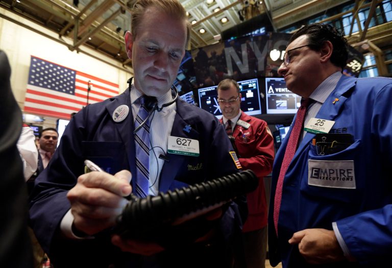 U.S. stocks were poised to open higher Thursday, as Wall Street returns from the Christmas holiday, helped by a report that showed fewer Americans were filing for unemployment benefits. (AP/Richard Drew)