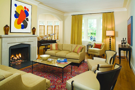 Area rugs define spaces in open, wood-floor layouts