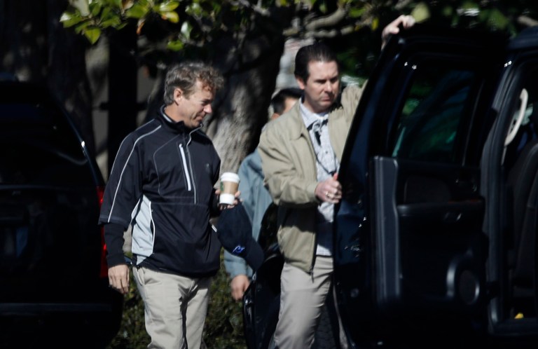 A Secret Service agent opens the door of the presidential vehicle for Sen. Rand Paul, R-Ky, left, on the South Lawn driveway at the White House in Washington, Sunday, April 2, 2017. (AP Photo/Manuel Balce Ceneta)