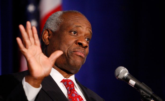 Supreme Court Justice Clarence Thomas addresses the Federalist Society in Washington, Thursday, Nov. 15, 2007, where he spoke about his new book and took questions from the audience. (AP Photo/Charles Dharapak)