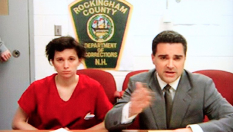   In this photo taken from a television monitor in district court in Derry, N.H.. Kathryn McDonough, left, appears during her video arraignment with lawyer Ryan Russman from the Rockingham County jail in Brentwood, N.H. Bail was set at $35,000 for McDonough, who is charged with lying to investigators about her whereabouts and involvement in the disappearance and death of a college student her boyfriend is accused of killing. (AP Photo)  