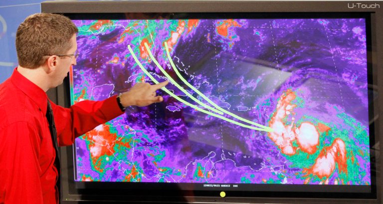 Dr. Rick Knabb, director of the National Hurricane Center, shows some of the possible trajectories tropical storm Isaac could develop in the coming days, Wednesday, Aug. 22, 2012, at the National Hurricane Center in Miami. As of 11:00 AM tropical storm Isaac's location 15.9 degrees north, 59.3 degrees west, about 140 miles east of Guadeloupe, maximum sustained winds 45 mph, present movement west or 280 degrees at 21 mph. (AP Photo/Alan Diaz)