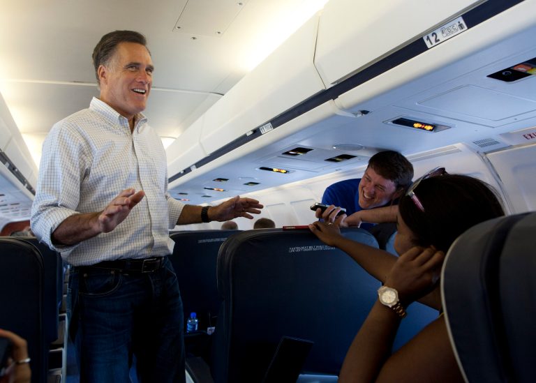   Republican presidential candidate, former Massachusetts Gov. Mitt Romney talks with the media aboard his plane at Quad Cities International Airport on Monday, June 18, 2012 in Moline, Ill. (AP Photo/Evan Vucci)  