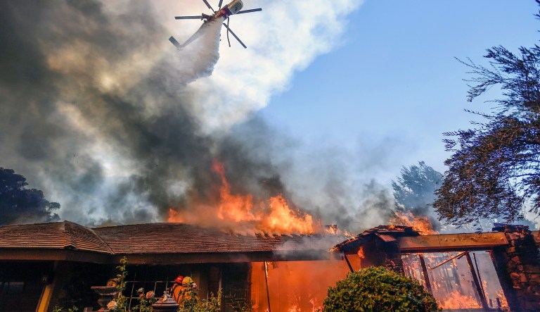 Pelosi called on GOP leaders to increase federal money in a hurricane disaster relief package to also include money for wildfire recovery. (Jeff Gritchen/The Orange County Register via AP)