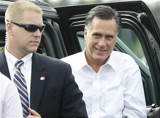 Republican presidential candidate Mitt Romney gets out of his vehicle before boards his campaign plane on Monday. (AP Photo)