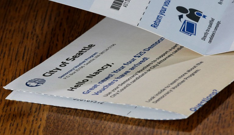 Seattle's democracy voucher program gives registered voters four $25 vouchers they can donate to candidates. The program was supposed to 