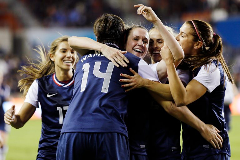   United States' Abby Wambach (14) celebrates with teammates after scoring a goal during the first half of an exhibition soccer match against China, Wednesday, Dec. 12, 2012, in Houston. (AP Photo/David J. Phillip)  