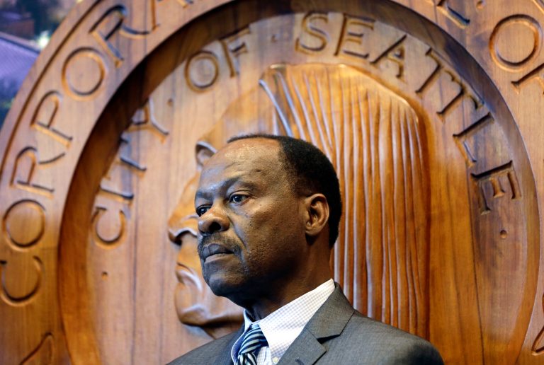 Seattle interim Police Chief Harry Bailey looks on at a news conference on police reform Feb. 4 in Seattle. Three days after holding a news conference to defend Seattle's police chief for erasing a misconduct finding against an officer, Mayor Ed Murray partially reversed course Monday, reinstating the original finding and saying the decision to lift it did not look like the kind of police reform his administration has promised. (AP Photo/Elaine Thompson)