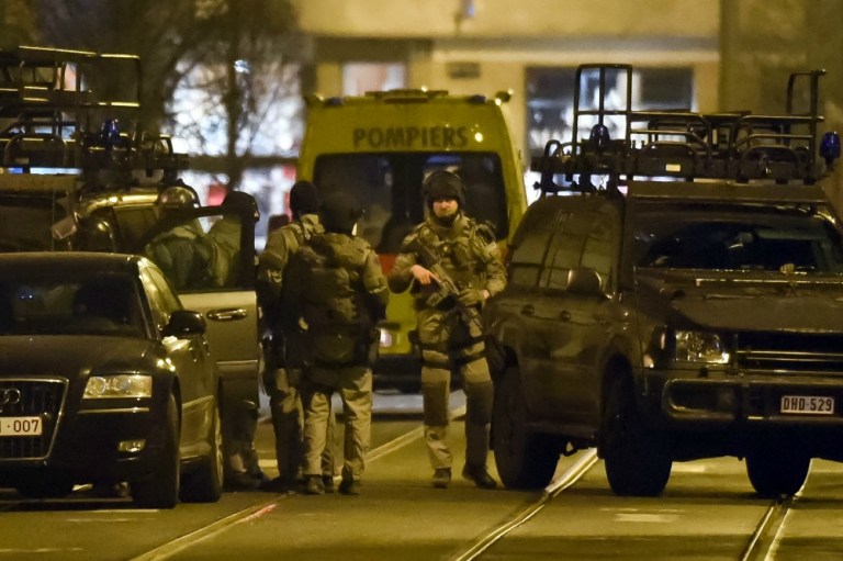 French President Francois Hollande says an important police operation is underway in a Brussels neighborhood in connection with the November Islamic extremist attacks in Paris. (AP Photo)