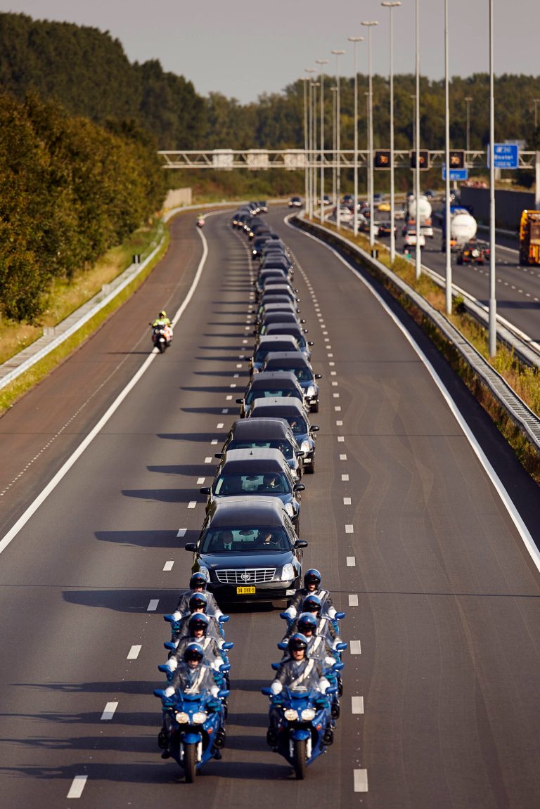 A convoy of hearses bearing the remains of passengers and crew killed in the downing of Malaysia Airlines Flight 17 makes its way along a highway near Boxtel, Netherlands, Thursday, July 24, 2014. The second flight of two military aircraft carrying remains of victims arrived in the Netherlands on Thursday. The bodies are to be taken to a military barracks in Hilversum, where a team of 25 forensic experts and dozens of support staff began working to identify remains Wednesday evening after coffins of the first flight arrived. (AP Photo/Phil Nijhuis)