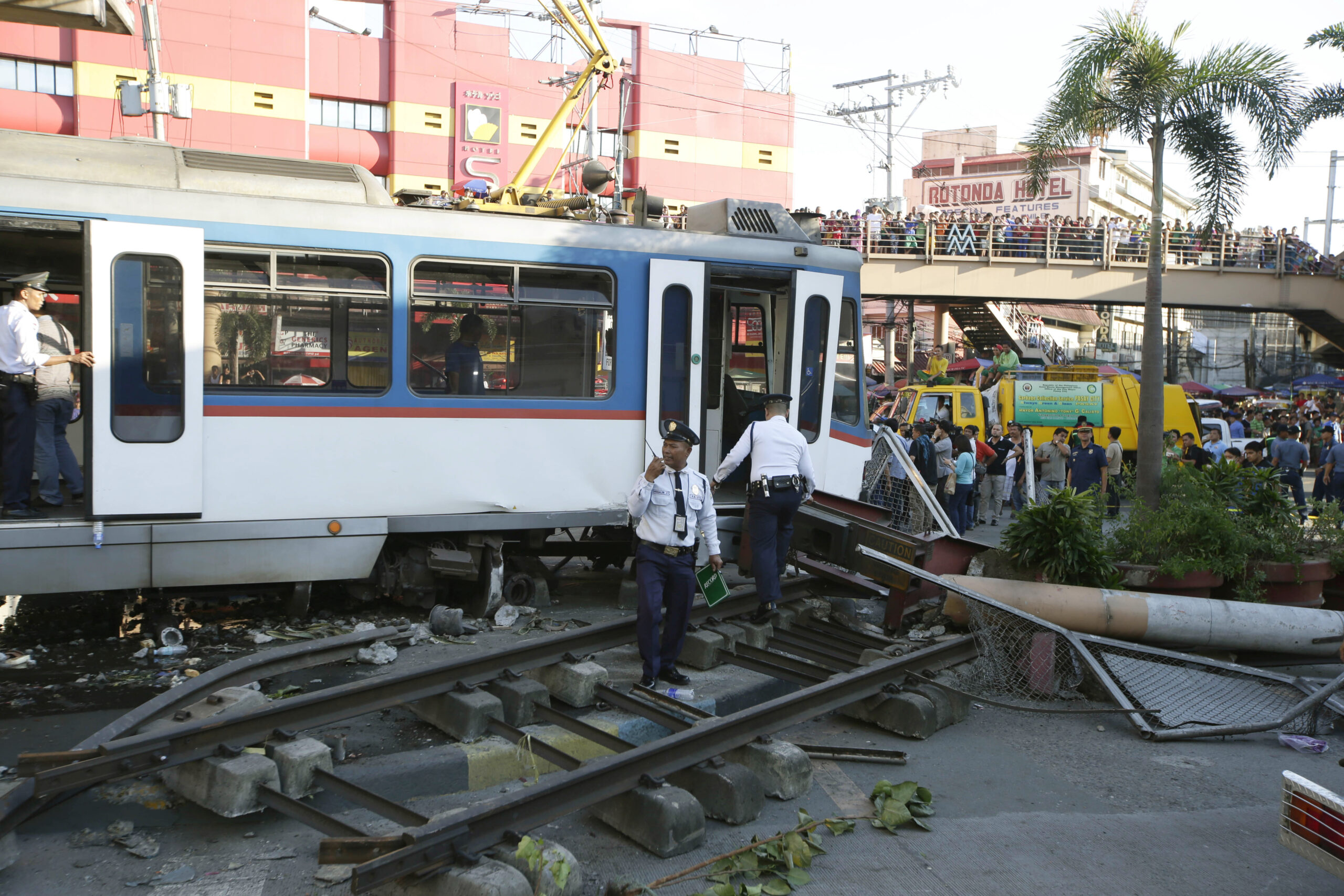 Philippine train rolls onto busy street, hurts 34