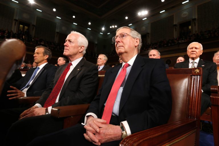Members of the Senate Republican leadership, including Conference Chair John Thune, from left, Minority Whip John Cornyn, and Minority Leader Mitch McConnell watch as President Obama delivers the State of Union address on Tuesday. (AP Photo/Larry Downing, Pool)