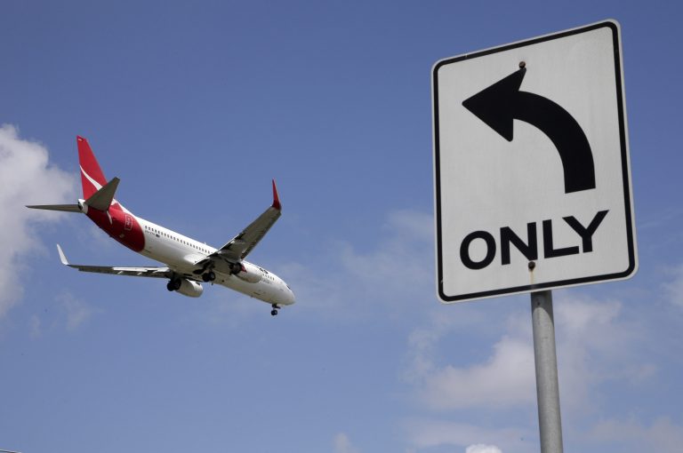 FILE - In this Thursday, Feb. 21, 2013 file photo, a Qantas plane prepares to land at Sydney Airport, at Sydney, Australia. Qantas Airways Ltd. ,on Thursday Aug. 21, 2014, posted a record 2.8 billion Australian dollar ($2.6 billion) statutory loss for the last fiscal year reflecting a profit-draining battle with its smaller rival Virgin Australia and aircraft write downs. (AP Photo/Rick Rycroft, File)