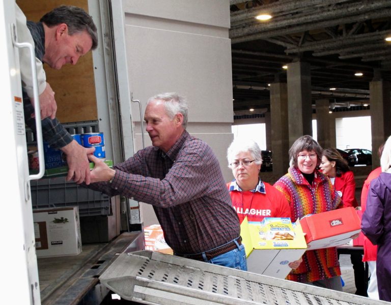 U.S. Sen. Ron Johnson, R-Wis., helps load food donations onto a truck as part of a charity event before the kickoff of the Wisconsin Republican Party convention on Friday, May 13, 2016, in Green Bay, Wis. (AP Photo/Scott Bauer)