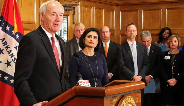 Gov. Asa Hutchinson speaks at a news conference Monday, March 5, 2018, at the state Capitol in Little Rock, Ark., with Seema Verma, the head of the Centers for Medicare and Medicaid Services. Verma on Monday approved a state plan to require that thousands of people on its Medicaid expansion seek ways to work or volunteer. Traditional Medicaid recipients are not affected. Arkansas is the third state to win permission, following Kentucky and Indiana. (AP Photo/Kelly P. Kissel)