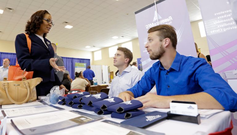 In this photo taken Wednesday, July 16, 2014, job seeker Staci Sudduth, left, talks to job recruiters Cameron Quin, center, and Jay Kington, right, at a Hiring Fair For Veterans in Fort Lauderdale, Fla. Payroll processor ADP reports how many jobs private employers added in July on Wednesday, July 30, 2014. (AP Photo/Alan Diaz)