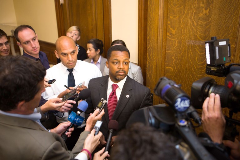 Councilman Kwame Brown is questioned by reporters at City Hall in May. Brown later pleaded guilty to lying on a bank loan to buy a luxury boat.
