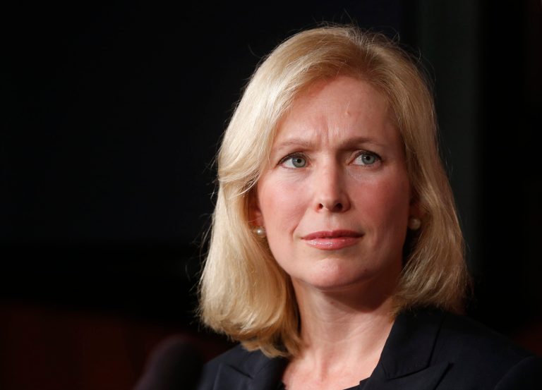 Sen. Kirsten Gillibrand, D-N.Y., listens as Sen. Ted Cruz of Texas speaks to reporters during a news conference about a bill regarding military sexual assault cases, on Capitol Hill in Washington on July 16.