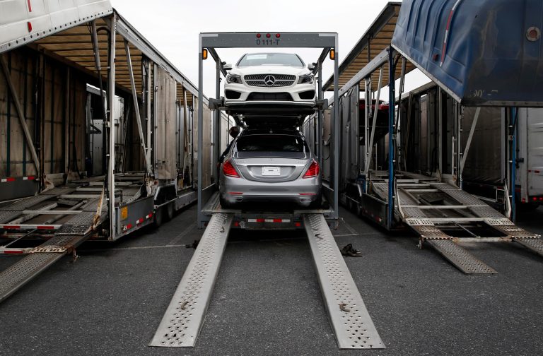 In this March 27, 2014 picture, a Mercedes-Benz sedans sit inside a car-carrier before being hauled away for distribution from the company's Vehicle Processing Center in Baltimore. The Commerce Department reports on the U.S. trade deficit for March on Tuesday, May 6, 2014. In February, the gap climbed to its highest level in five months as demand for American exports fell while imports rose slightly. (AP Photo/Patrick Semansky)
