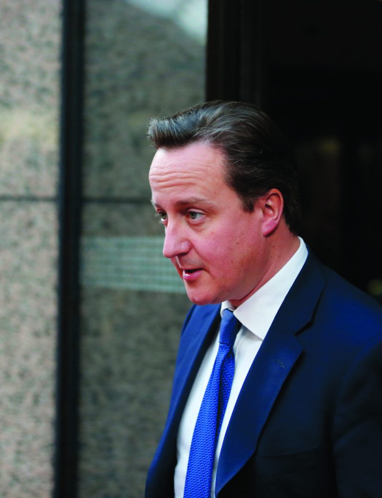 British Prime Minister David Cameron leaves the building after a bilateral meeting at an EU summit in Brussels on Thursday, Nov. 22, 2012. EU leaders begin what is expected to be a marathon summit on the budget for the years 2014-2020. The meeting could last through Saturday and break up with no result and lots of finger-pointing. (AP Photo/Michel Euler)