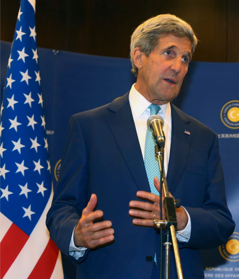 In this Friday, Sept. 12, 2014 photo, U.S. Secretary of State John Kerry speaks to the media in Ankara, Turkey. Turkey is the big Muslim power that sits atop raging conflicts in Iraq and Syria, so it might be expected to take a leading role in the NATO coalition announced this month to take on the Islamic State group. Instead it told allies that it would stay quietly behind the scenes, keeping its soldiers out of combat operations and even declining to allow NATO to use its bases or territories to launch air attacks. (AP Photo/Burhan Ozbilici)