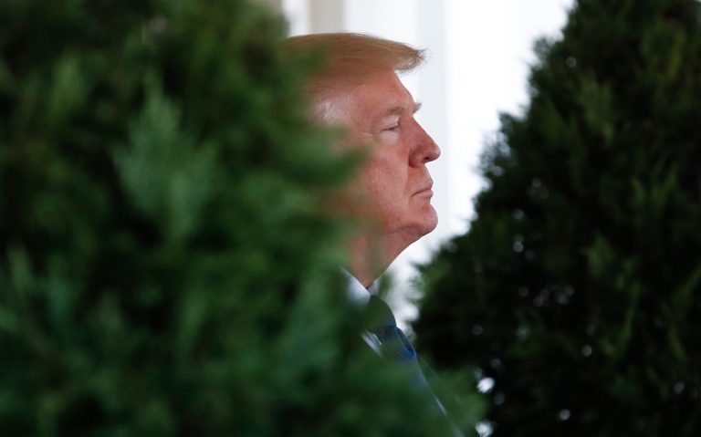President Donald Trump waits outside the West Wing of the White House in Washington, Tuesday, Jan. 16, 2018, to greet Kazakhstan's President Nursultan Nazarbayev. (AP Photo/Carolyn Kaster)